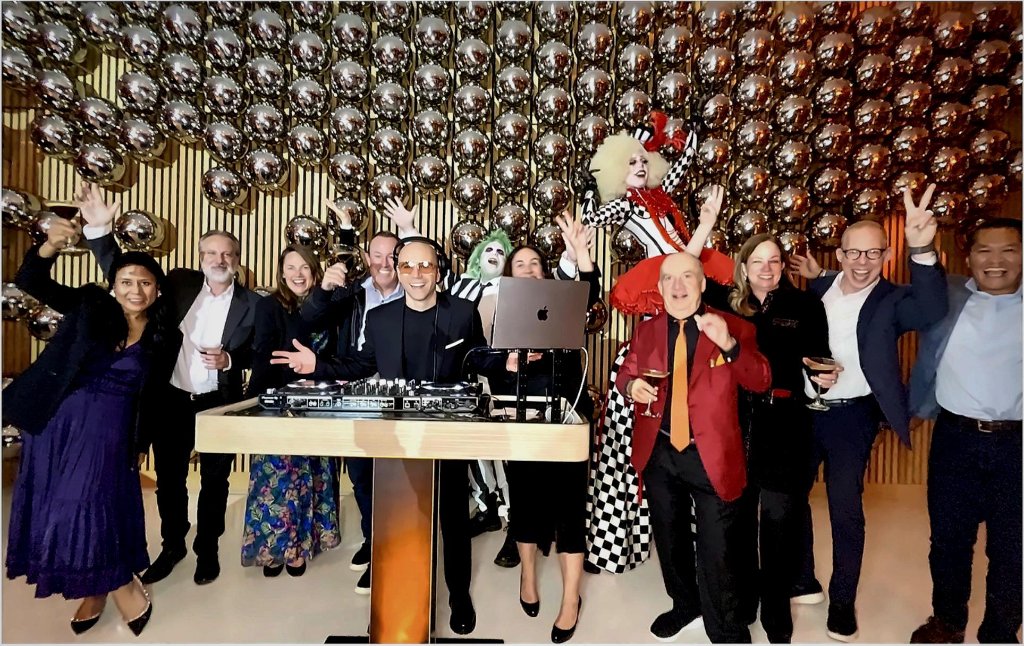 B.MILLS with guests at corporate cocktail reception